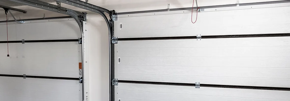 Fix Folding Garage Door Jerking in Aurora, Ontario