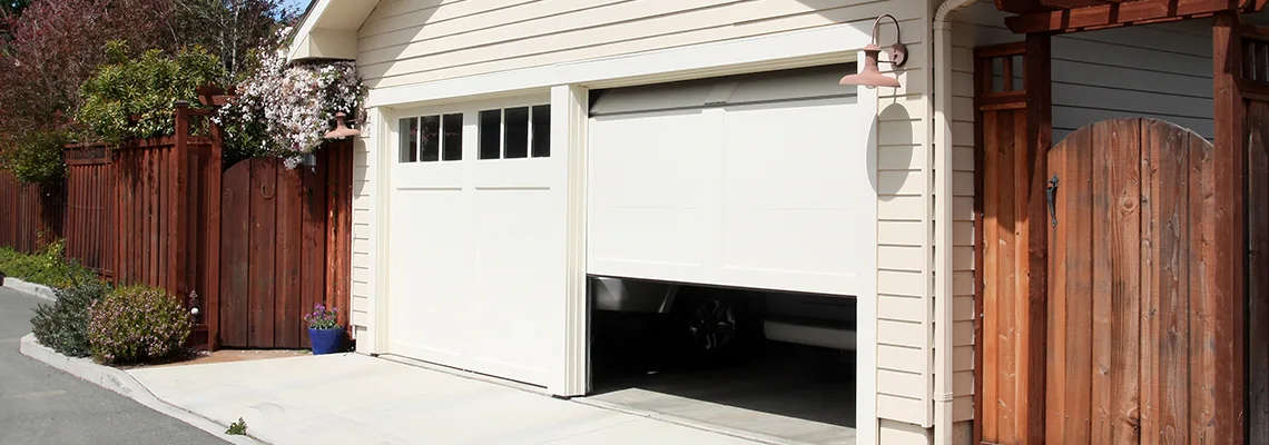 Fix Metal Garage Door Jerking in Aurora, Ontario